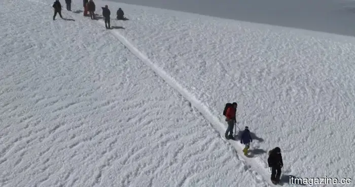 A humanoid robot ascended a volcano, aided by some very human assistance.